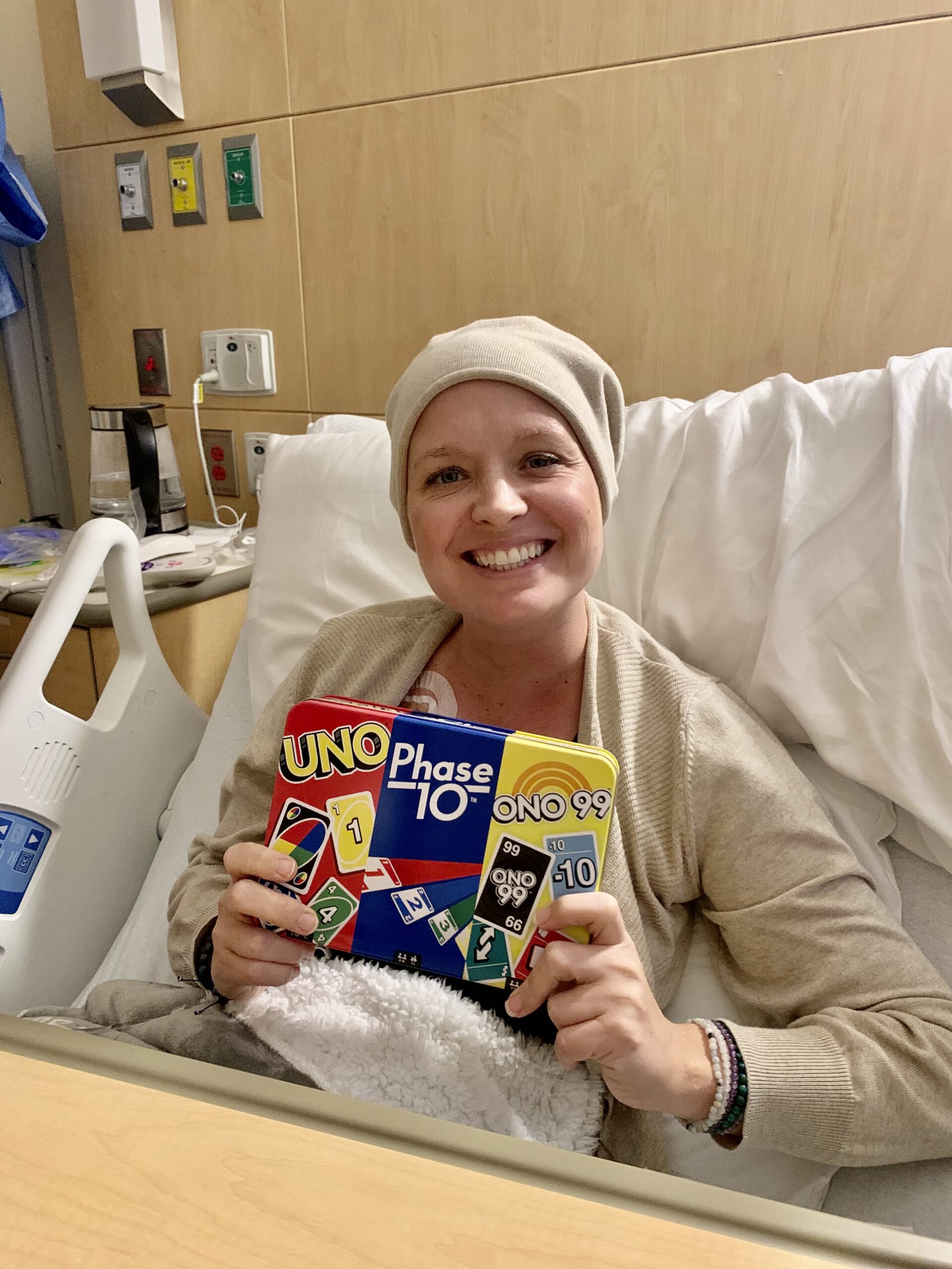 Amanda smiling for the camera with games in her hand