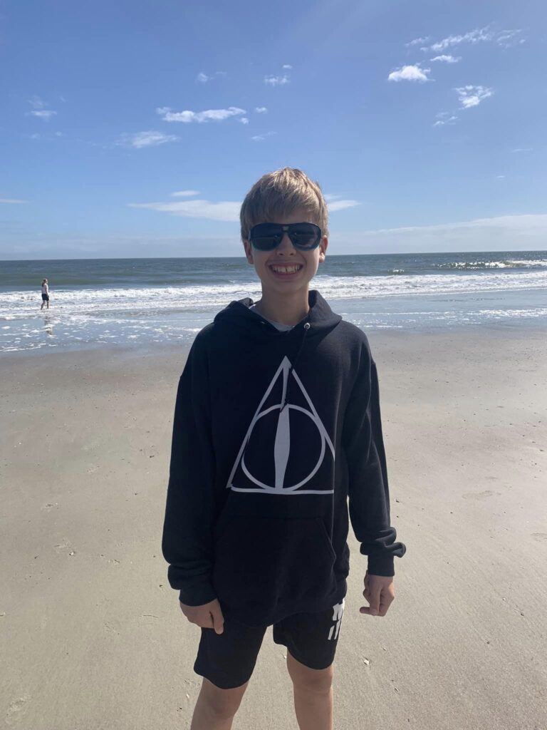 boy standing by the shore