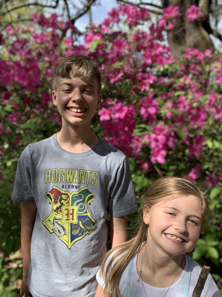 brother and sister smiling for the camera